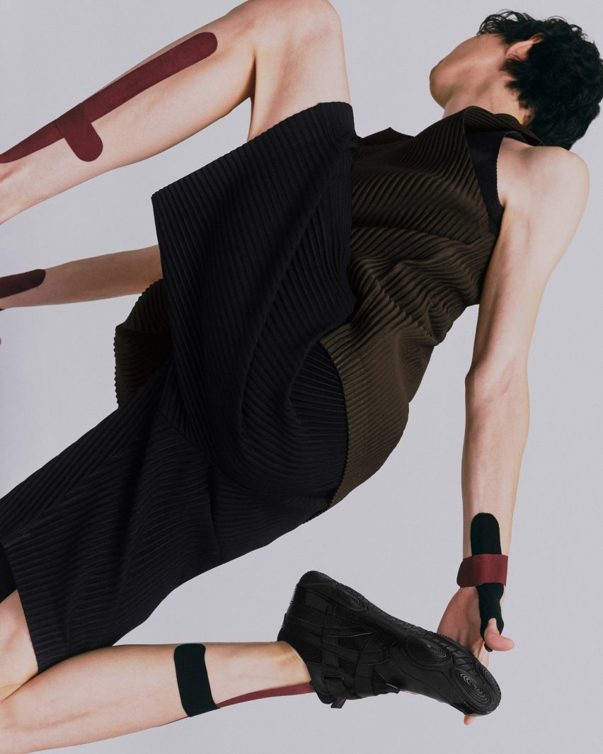 Person wearing black Hyper Taping trainers by Issey Miyake