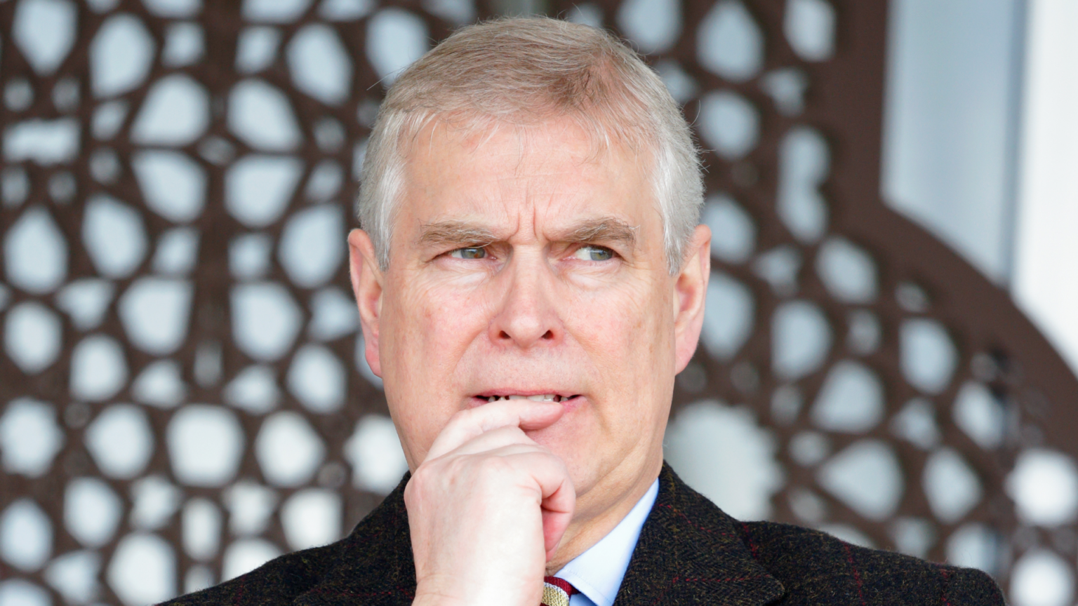 Prince Andrew putting his finger to his mouth