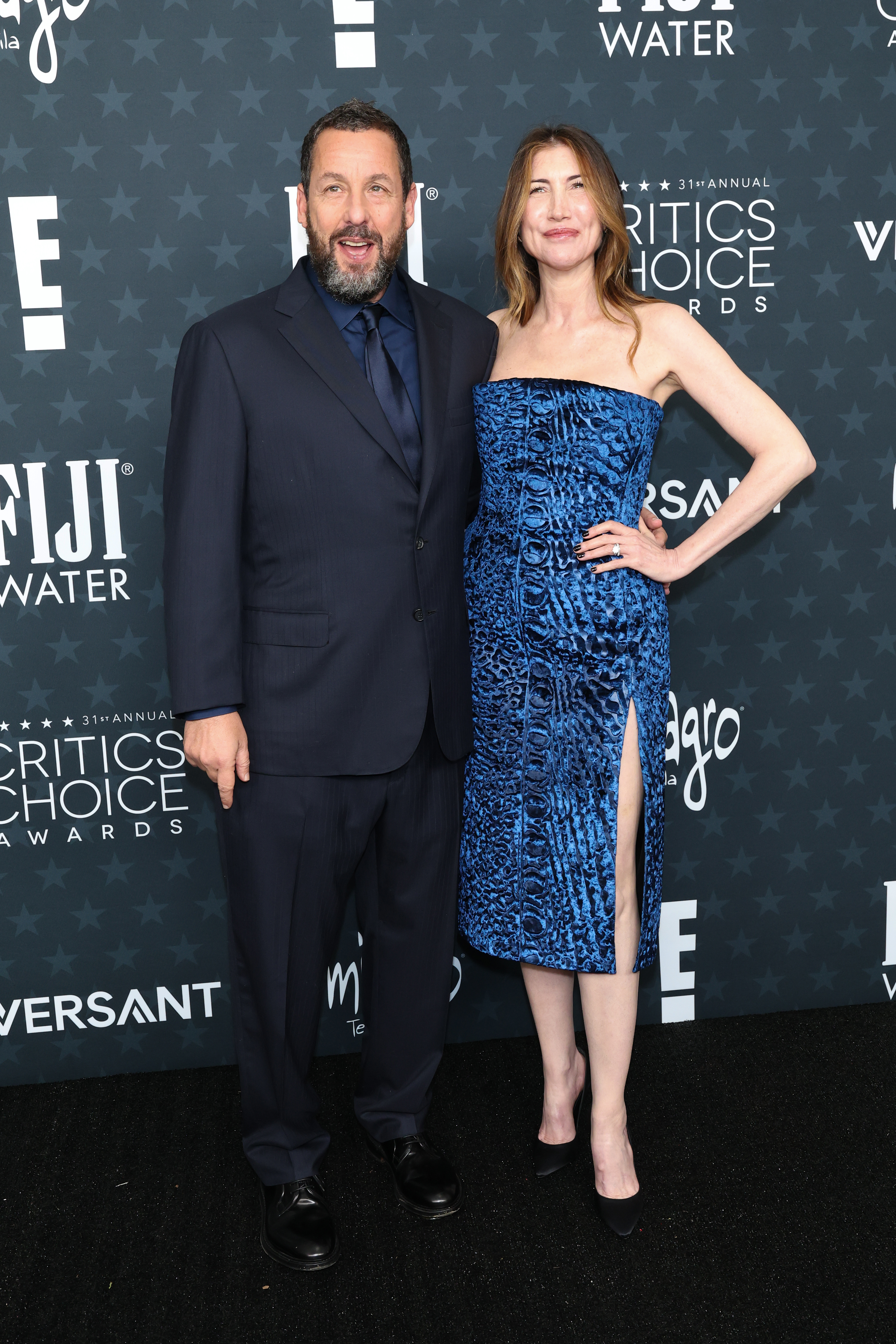 Adam and Jackie Sandler attend the 31st Annual Critics Choice Awards at Barker Hangar on January 04, 2026 in Santa Monica, California