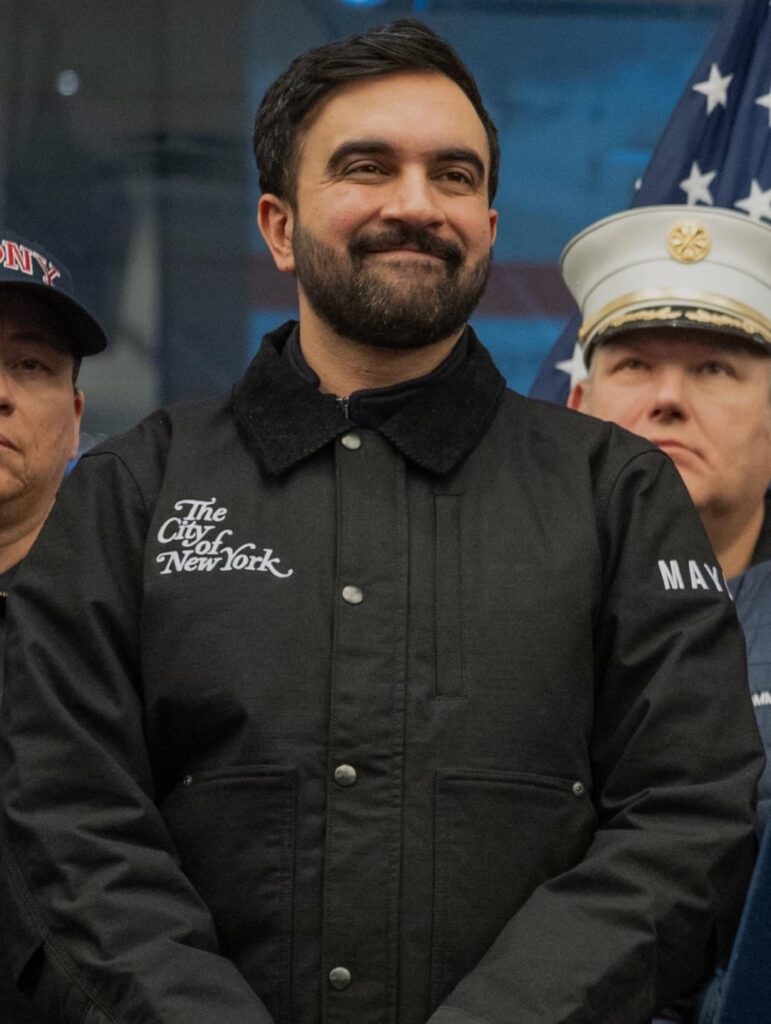 At a press conference for this past weekend's snowstorm, NYC Mayor Zohran Mamdani wore a personalized Carhartt jacket with a quote embroidered on the collar: “No problem too big. No task too small.” The jacket was custom-embellished by the Brooklyn-based company Arena Embroidery.