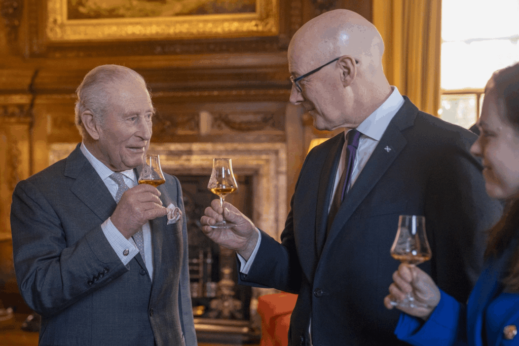King Charles shares a dram of whisky with First Minister of Scotland, John Swinney at the Palace of Holyroodhouse in Edinburgh