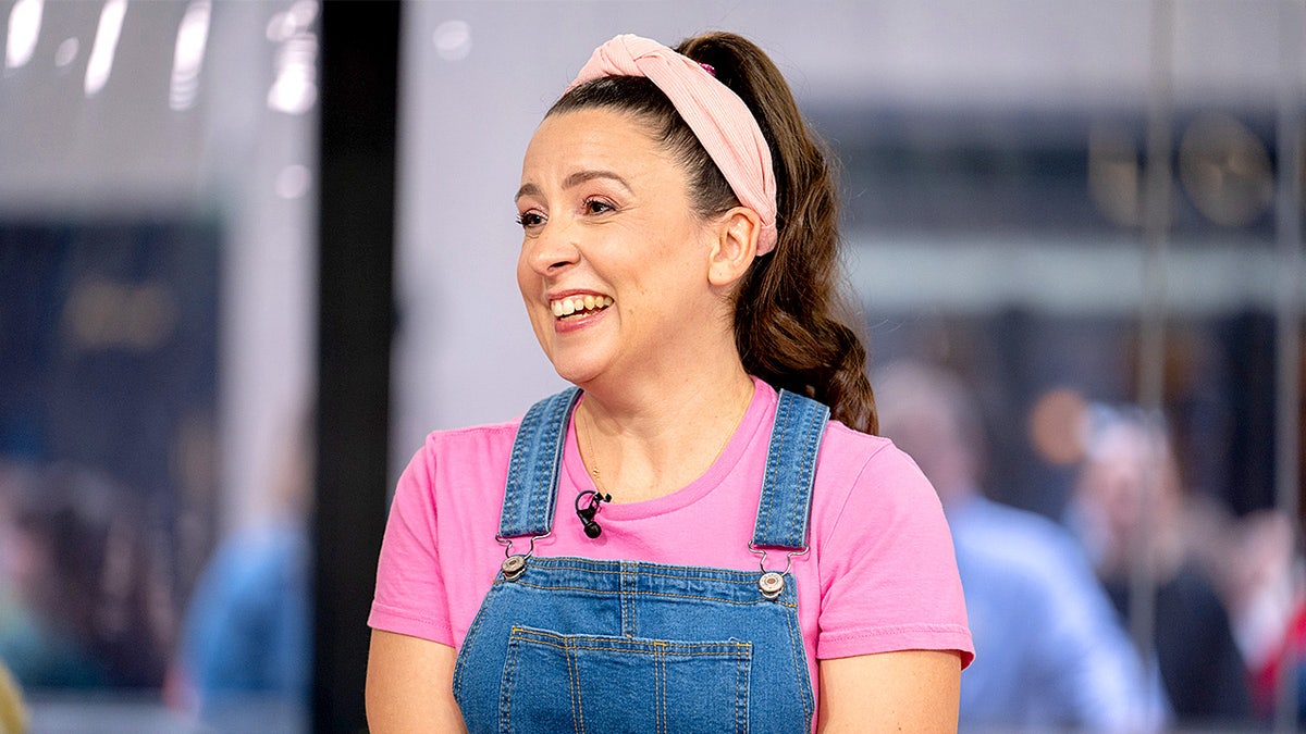 Ms. Rachel poses while standing during a television appearance.