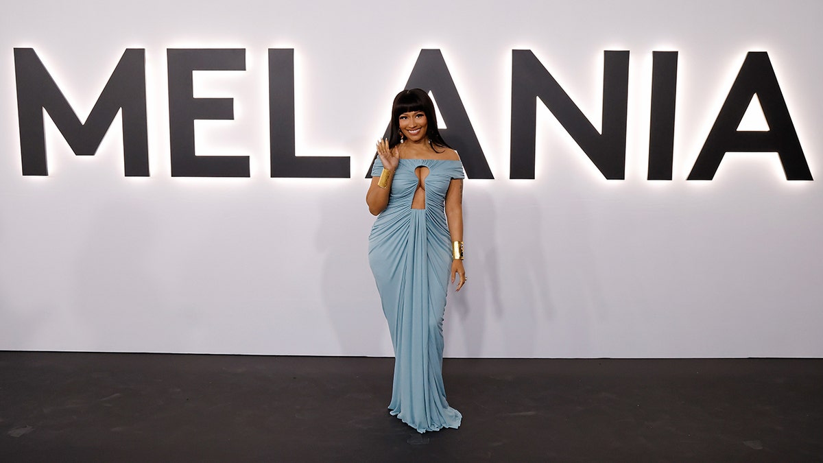 Nicki Minaj in a long light blue gown at the red carpet of "Melania" premiere.