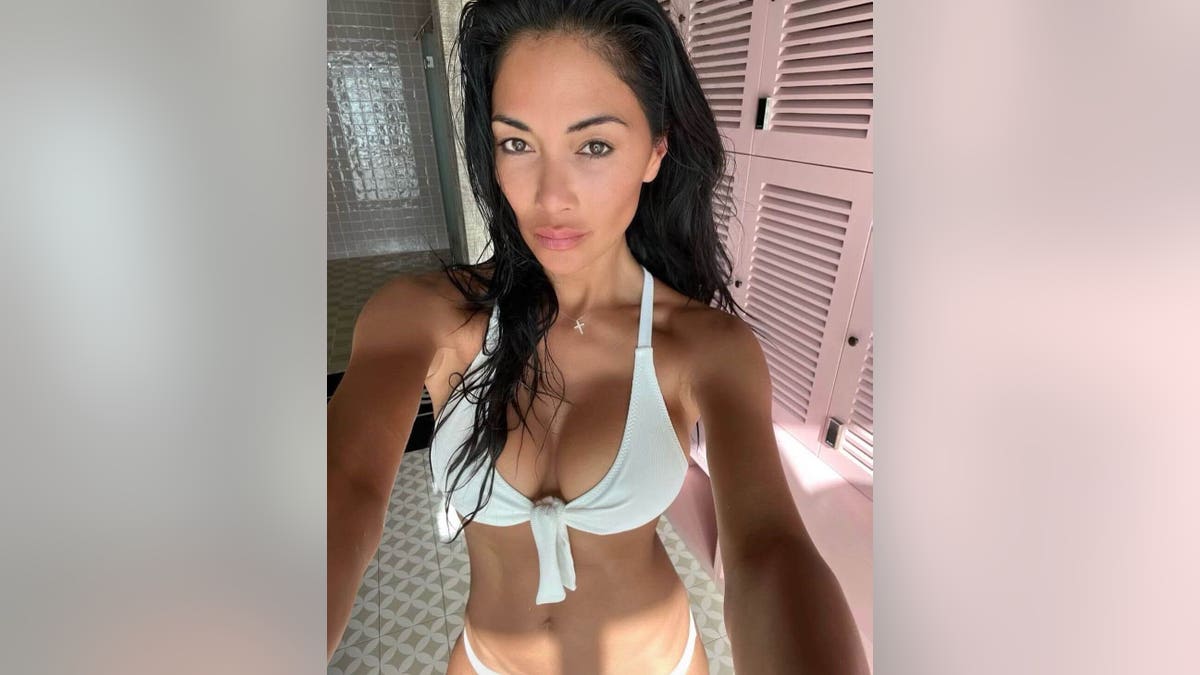 Nicole Scherzinger in a bikini near a sauna