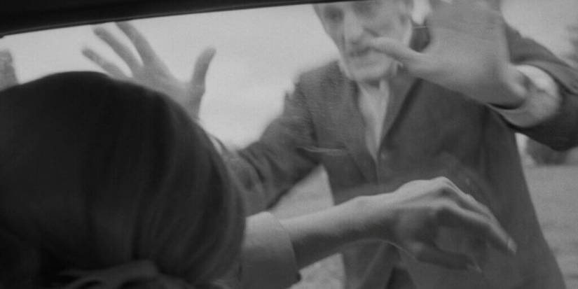 A zombie tries to break into a car in 'Night of the Living Dead'
