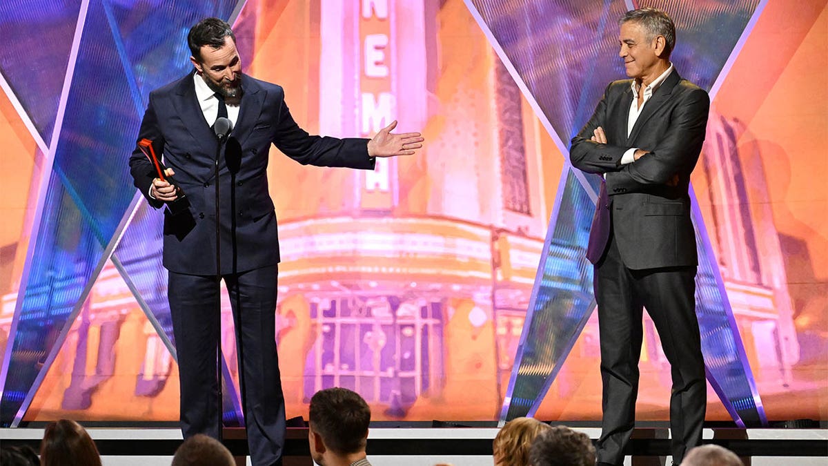 Noah Wyle and George Clooney on stage