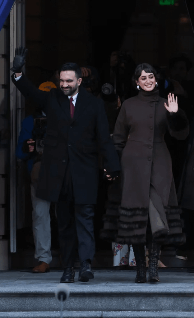NYC First Lady Rama Duwaji wore a coat by Palestinian-Lebanese label Renaissance, Renaissance to Zohran Mamdani’s mayoral inauguration. For the swearing-in, she chose a thrifted vintage Balenciaga coat with Miista boots; the mayor wore SuitSupply and a tie with jacquard motifs by Kartik Research.