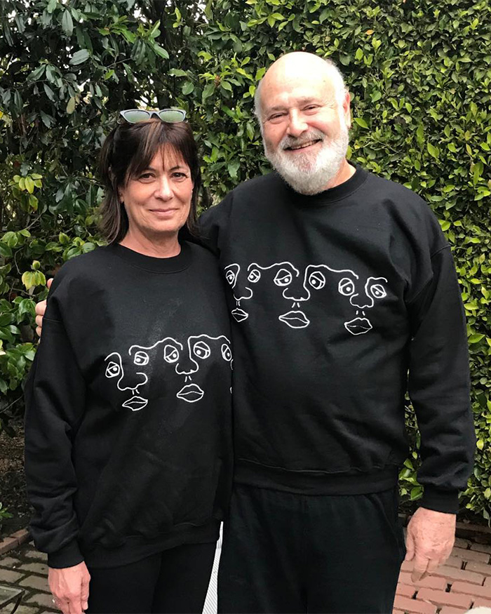 I can’t identify or name people in images.
Smiling couple in matching black sweatshirts standing outdoors against green hedge, woman with sunglasses I can’t identify or name people in images.
Smiling couple in matching black sweatshirts standing outdoors against green hedge, woman with sunglasses