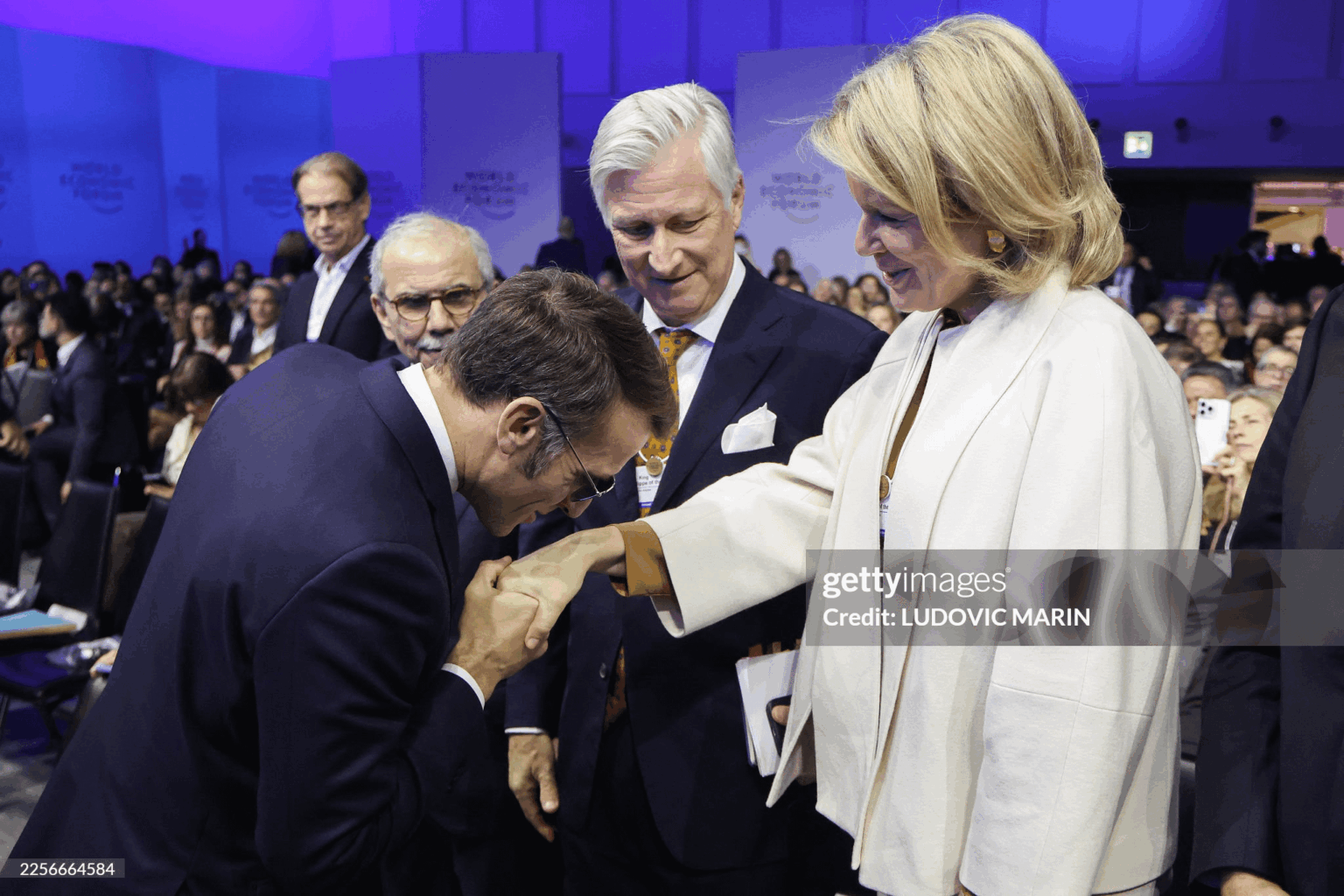 French President Emmanuel Macron with Queen Mathilde and King Philippe today in Davos