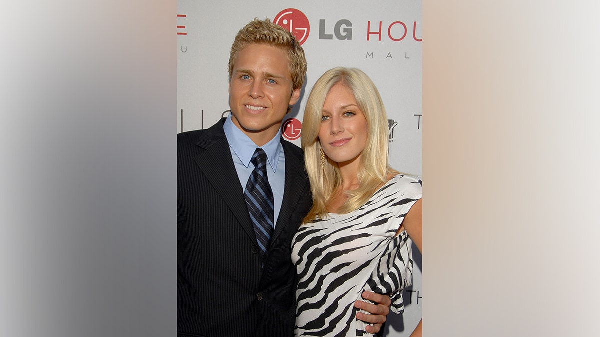 Spencer Pratt and Heidi Montag posing together on a red carpet.