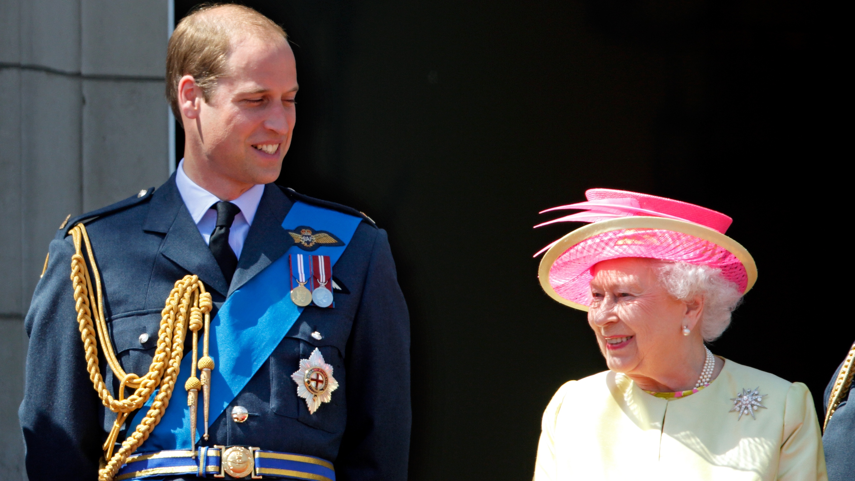 Prince William and Queen Elizabeth II watch a flypast of Spitfire &amp; Hurricane aircraft from the balcony of Buckingham Palace to commemorate the 75th Anniversary of The Battle of Britain on July 10, 2015