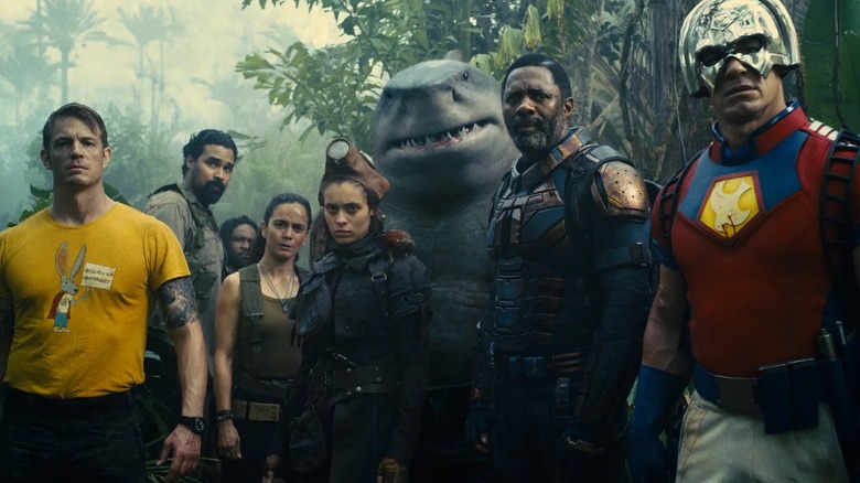 Members of the Suicide Squad standing around shocked in 