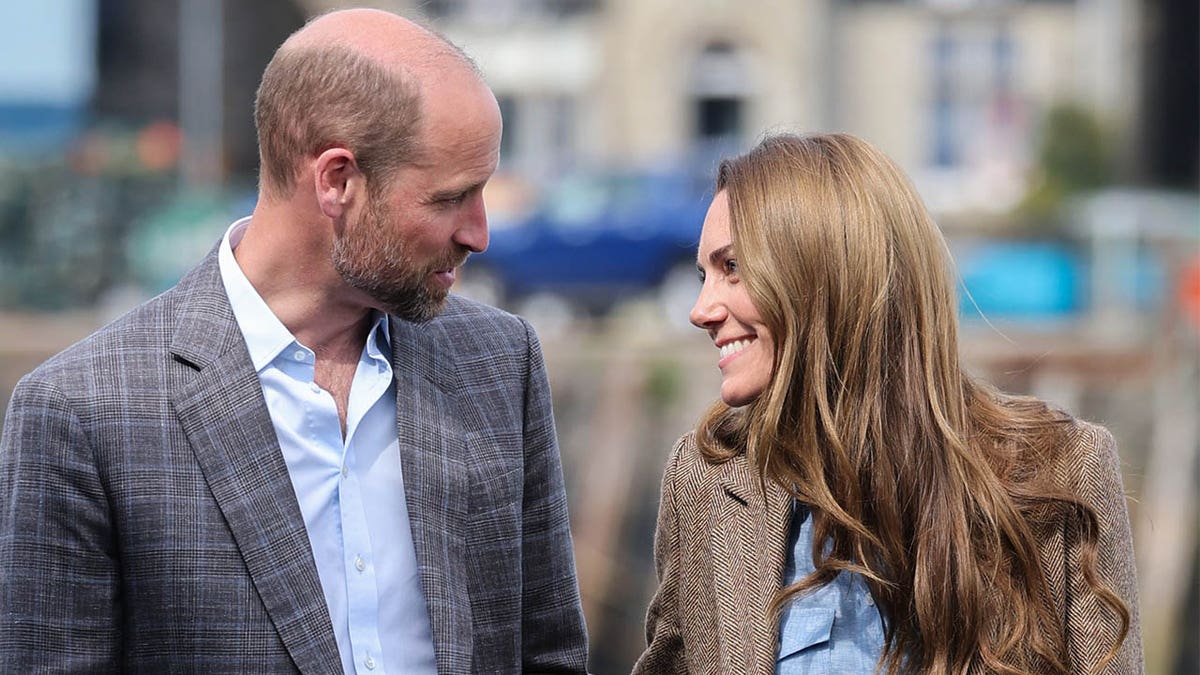 Kate Middleton and Prince William smile at each other 
