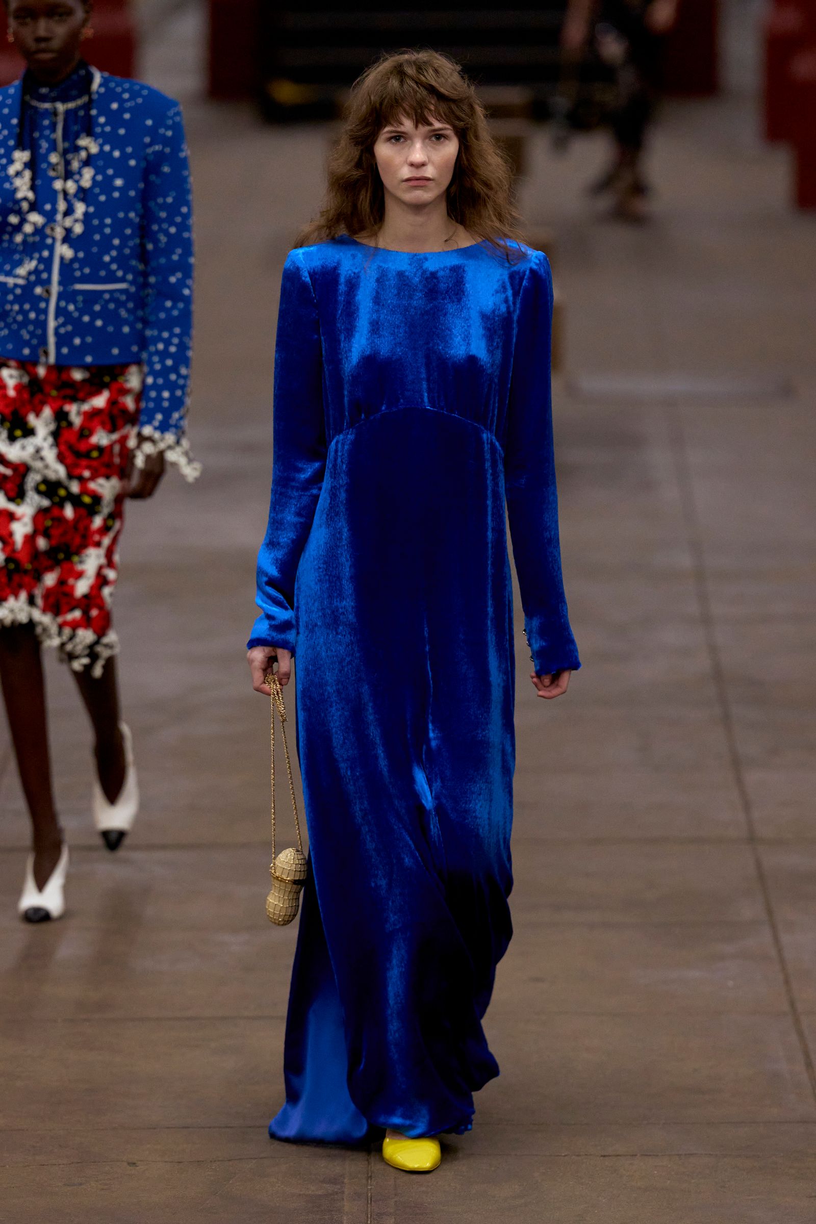 Image may contain Katie Aselton Salma Khalil Alio Person Adult Clothing Coat Footwear High Heel and Shoe