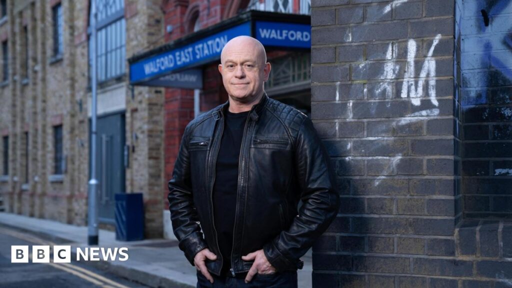 Actor Ross Kemp stands outside Walford East Station