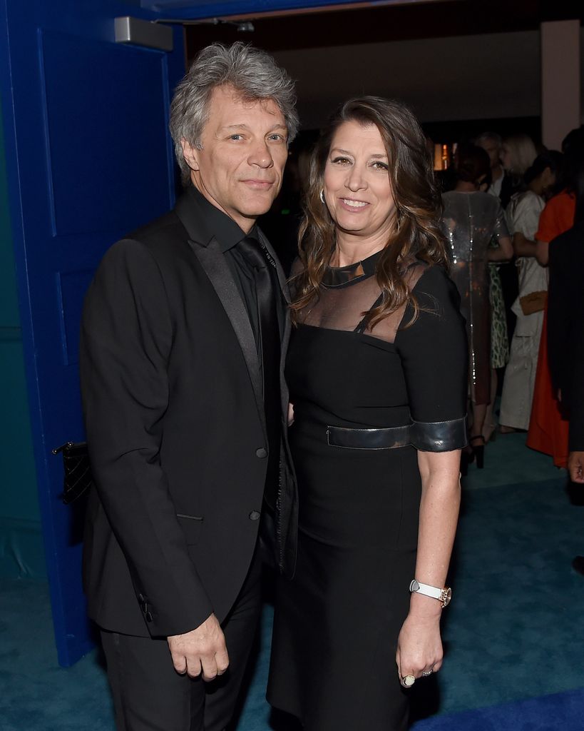 Jon Bon Jovi in a black suit with his wife Dorothea.