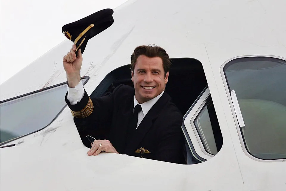 ohn Travolta waves from the cockpit of an Airbus A380, 2005 Jonathan Wood/Getty