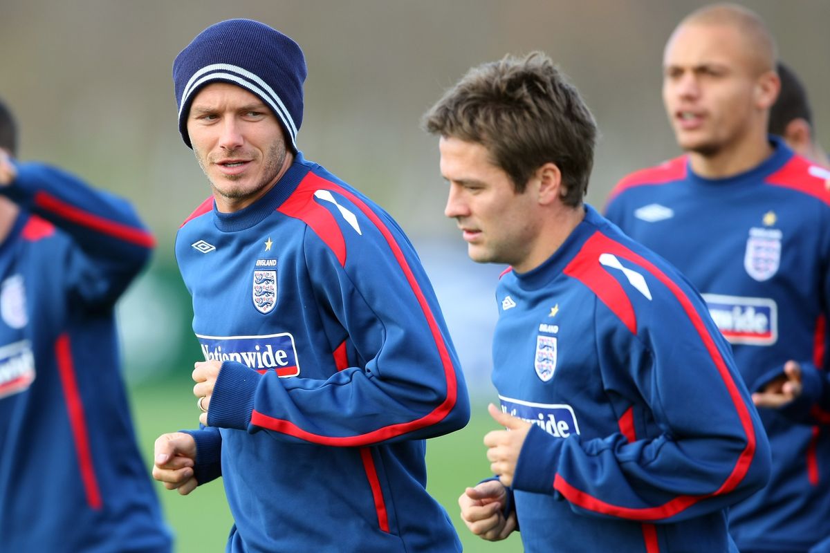Michael Owen and and David Beckham warm up during an England training session at London Colney Training Ground on November 14, 2007