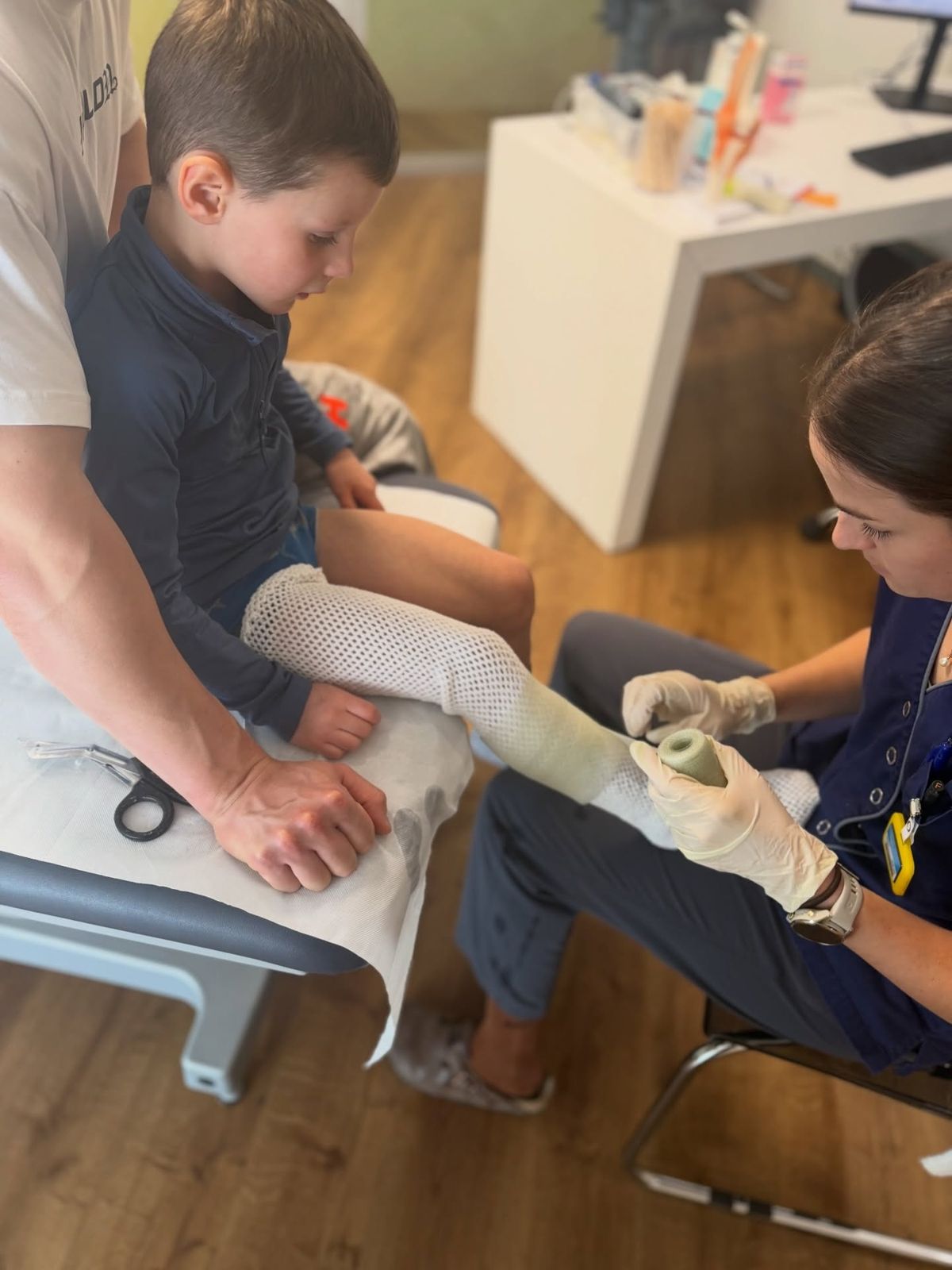 Mauro Morsia having his leg put in a cast