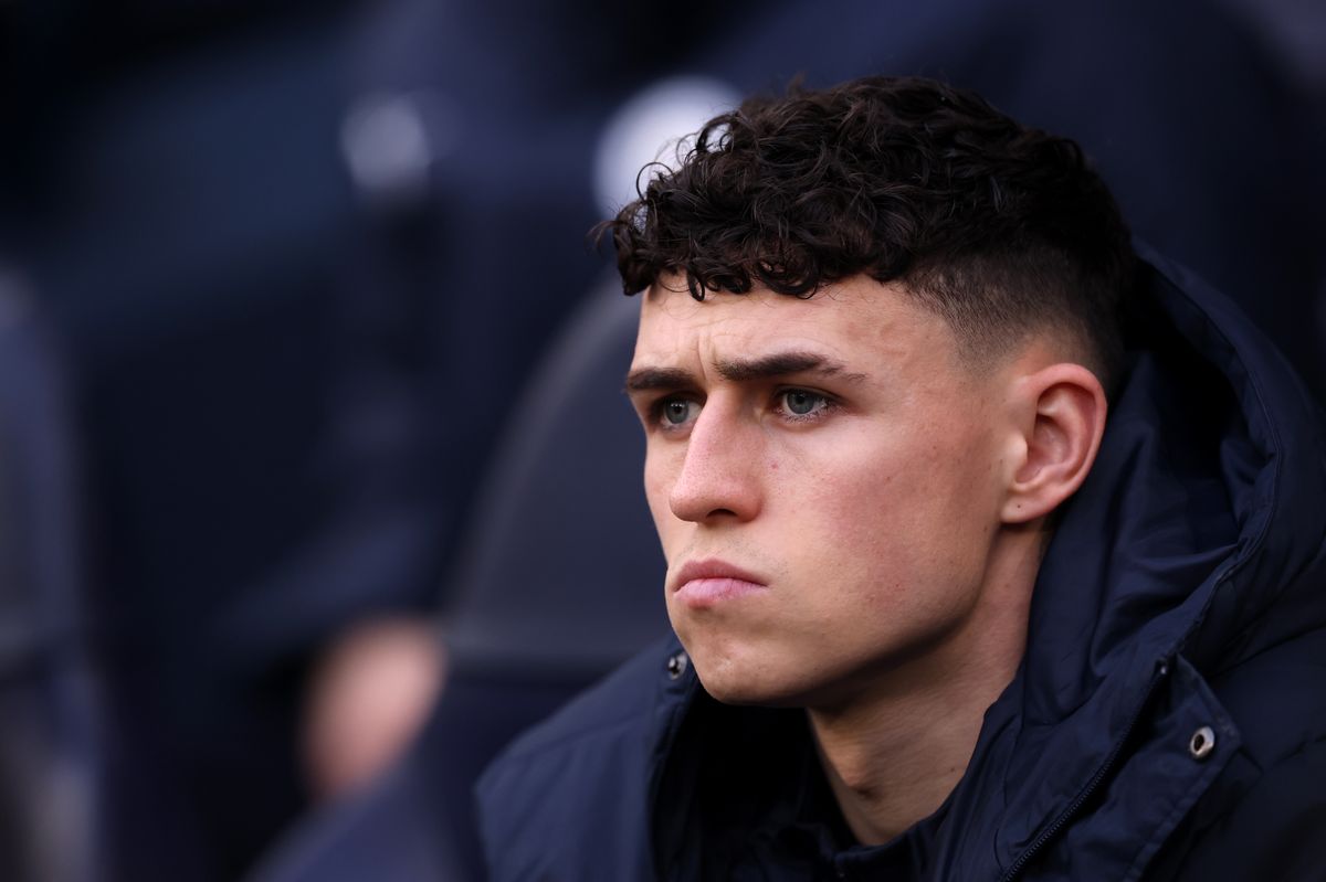 Phil Foden of Manchester City looks on from the substitutes' bench prior to the Premier League match between Manchester City and Wolverhampton Wanderers