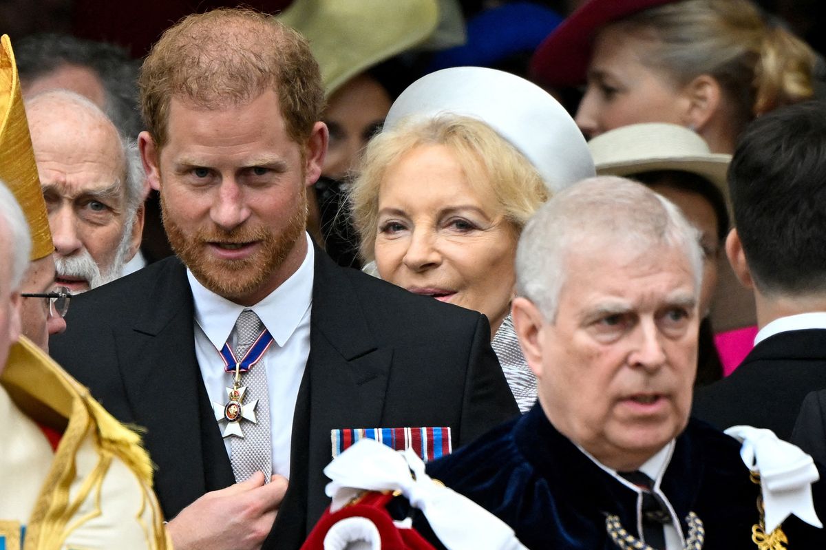 Prince Harry, Duke of Sussex (L) and Andrew leave after attending the coronations of Britain's King Charles III and Britain's Camilla, Queen Consort.