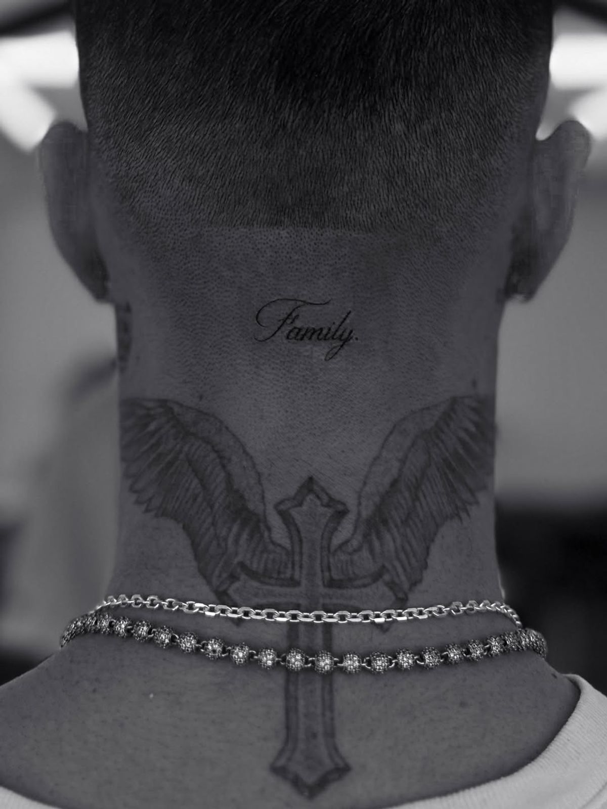 Romeo Beckham's new neck tattoo says the word 'family'