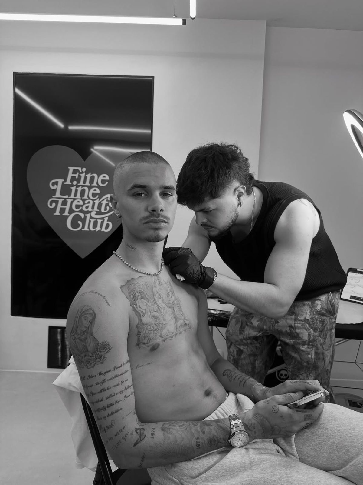 Romeo Beckham gets a tattoo at in London's Soho at Fine Line Hearts Club
