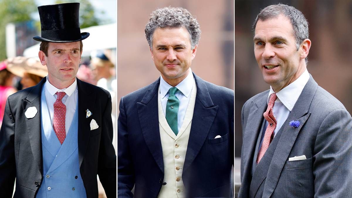 Three men, dressed in formal attire, stand next to each other. The first man on the left is wearing a black suit with a red tie and a top hat. The man in the middle is dressed in a navy blue suit with a green tie and a white vest. The third man on the right is wearing a gray suit with a red tie and a pin on his lapel.