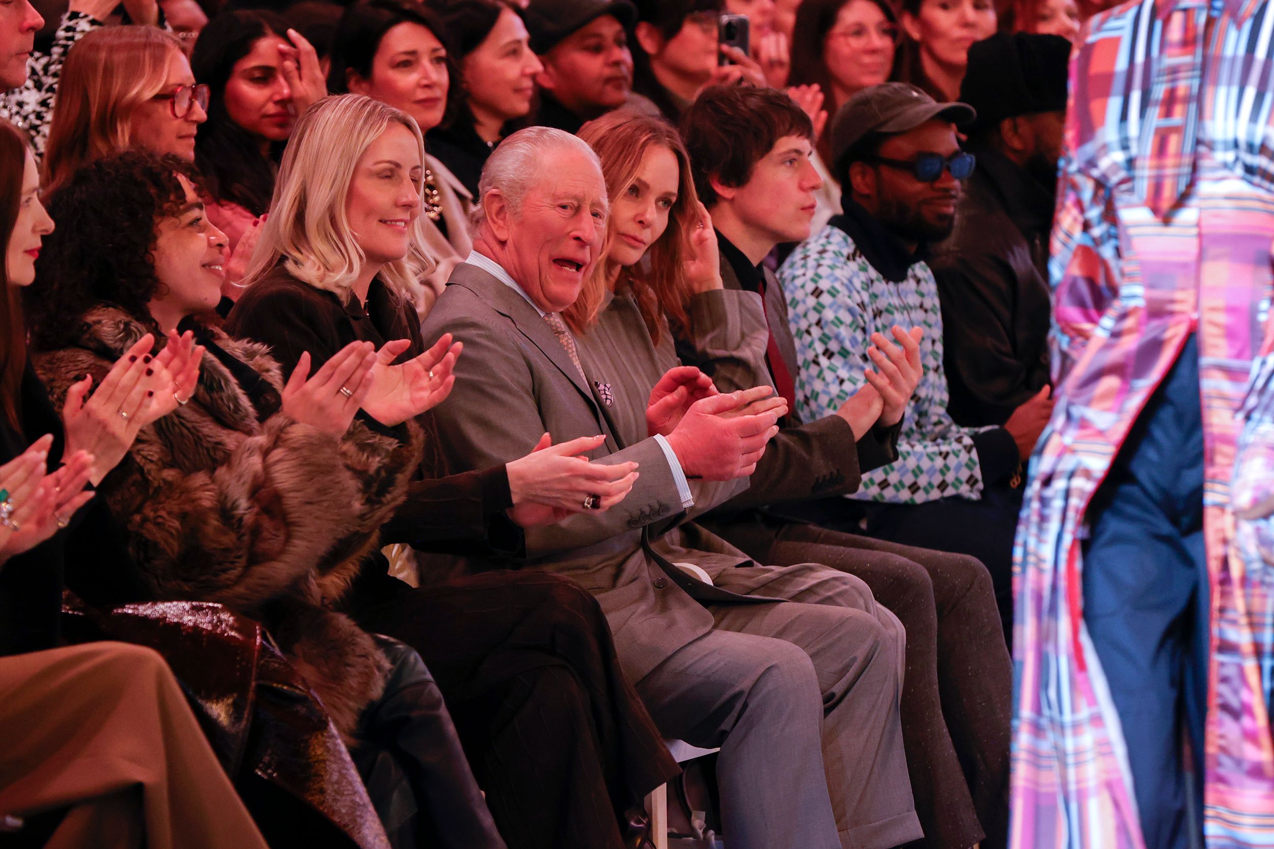 A photo of King Charles sitting Front Row at London Fashion Week
