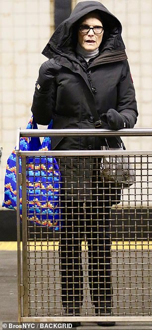 She wore a stylish ensemble of a pale grey turtleneck and dark slim-fit jeans