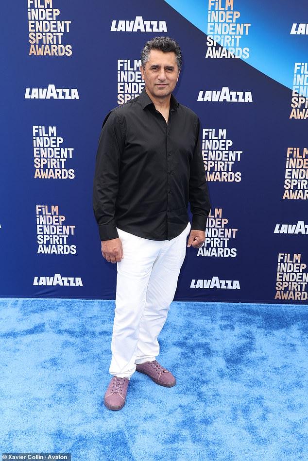 He completed the look with lavender sneakers