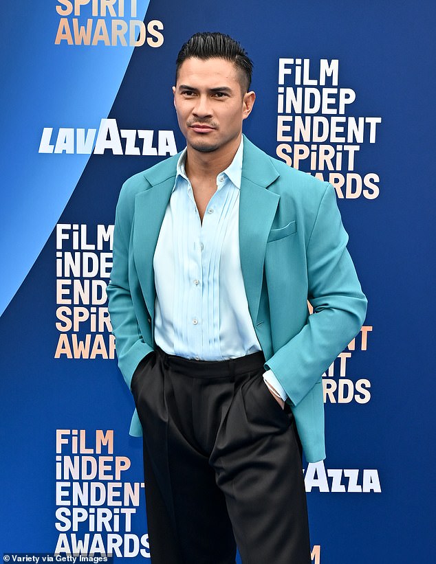 His hair was gelled back