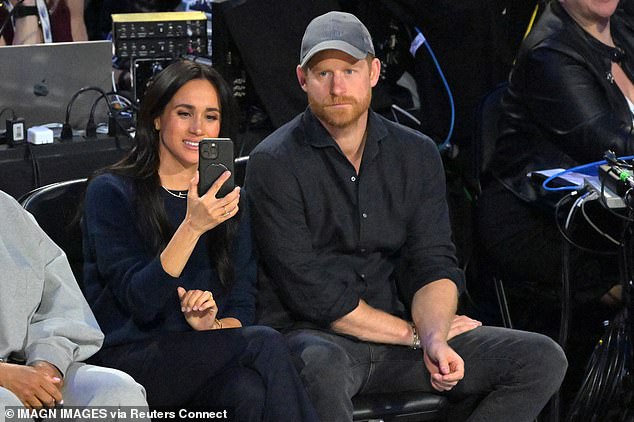 The 44-year-old appeared to be filming the likes of LeBron James on her iPhone