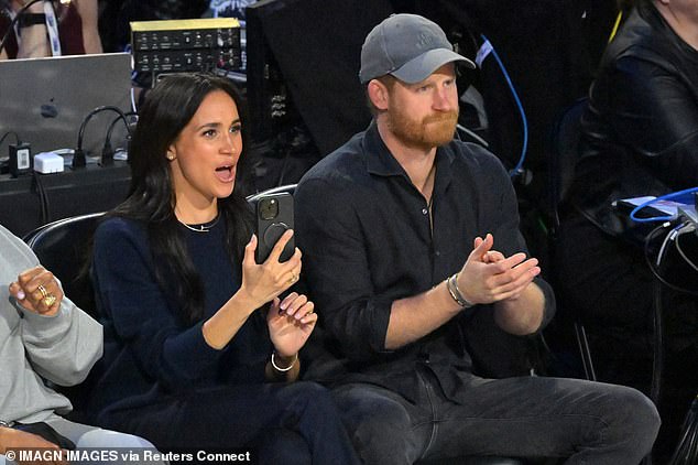 The Duchess of Sussex appeared particularly engrossed in the action as she let out a cheer