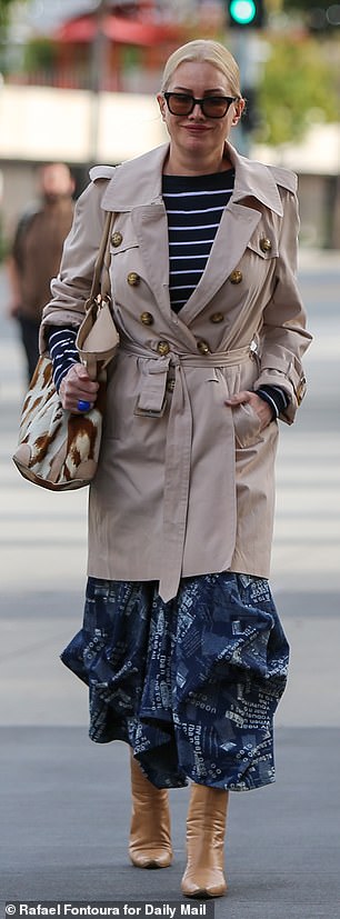 Alice Evans smiled as she turned up for Monday's hearing