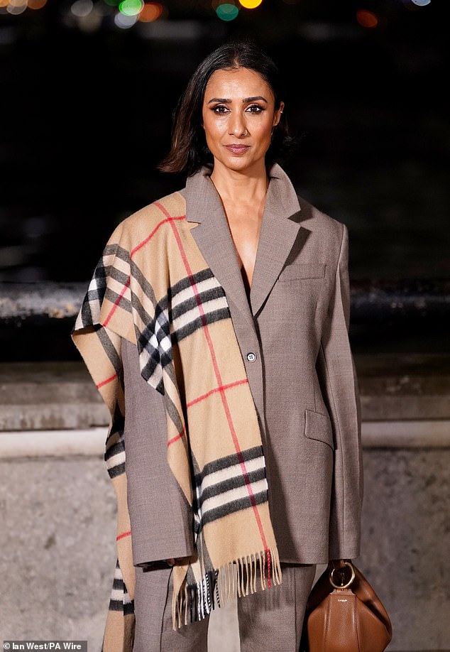 Hours after impressing in a daring dress, the presenter paid homage to the designer with one of their signature scarves and a grey double-breasted suit for the show