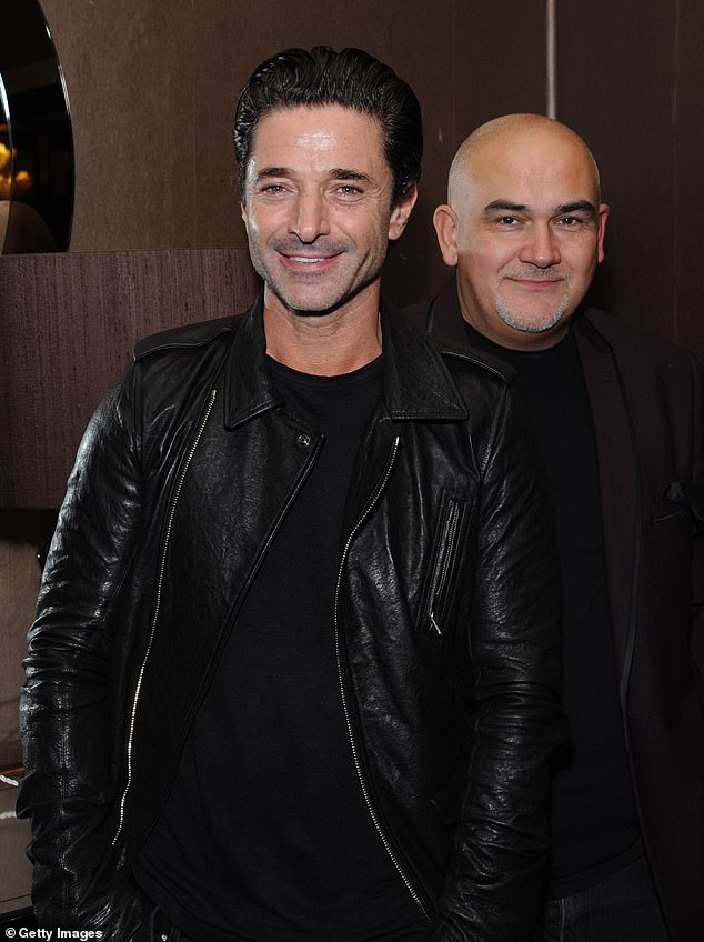 He and Jake, 56, who divorced in 2024, lived together in Spain for a decade before their split (pictured in 2014)