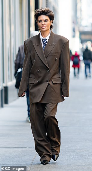 She later changed into a number of different looks, including an oversized brown men's suit and an equestrian-inspired designer ensemble