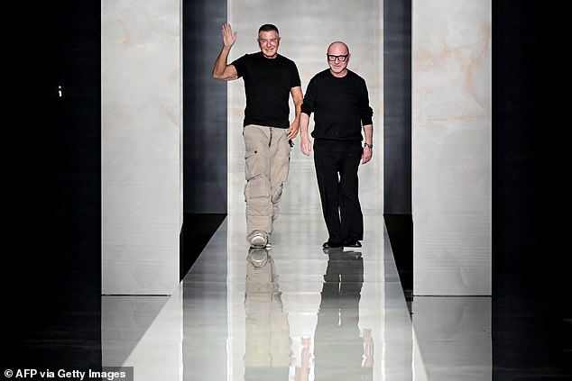 Domenico Dolce and Stefano Gabbana are seen walking the runway after their fashion show in Milan