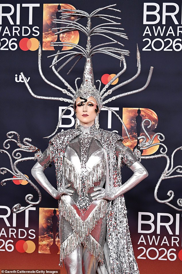 RuPaul's Drag Race star Marmalade made sure all eyes were on her in an extravagant silver tasseled dress with bizarre headpiece