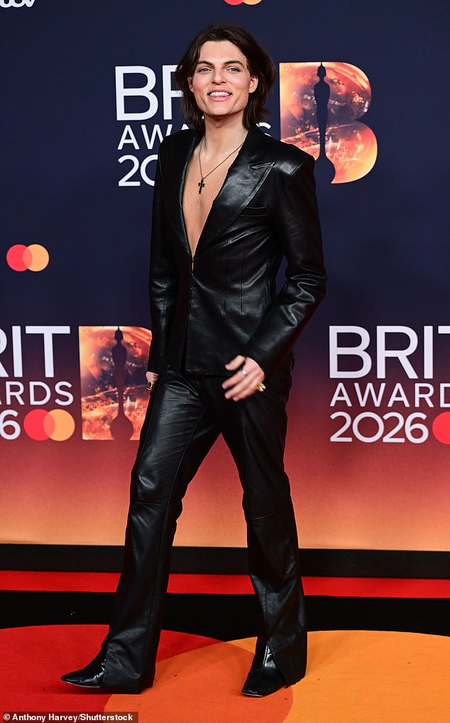 Damian Hurley showed of his model looks as he went shirtless in a black leather two-piece suit