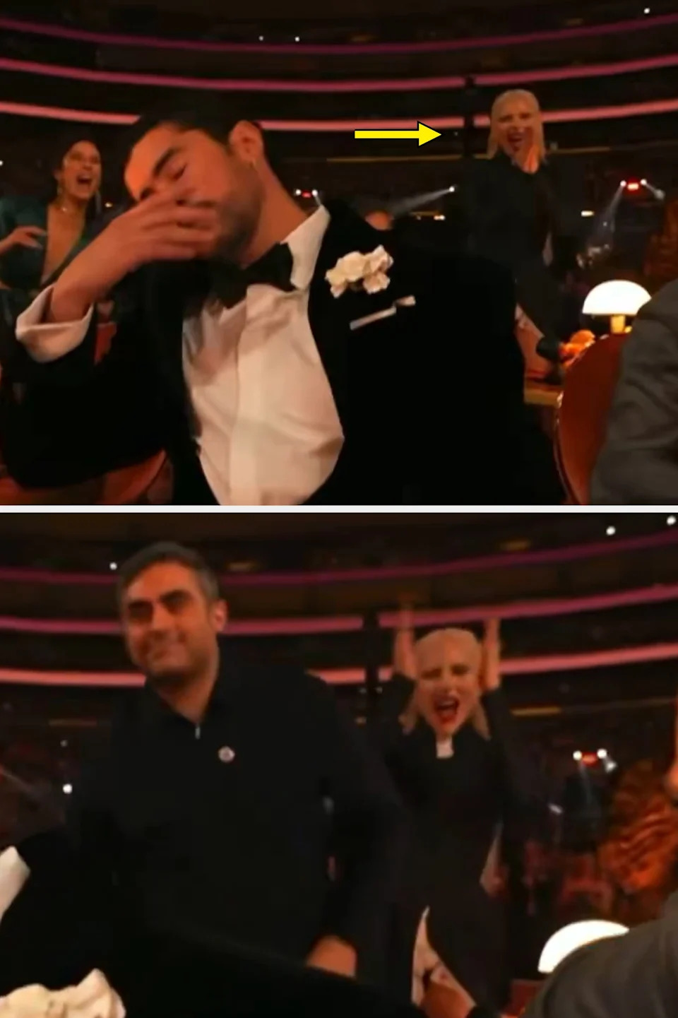 A man in a tuxedo with a floral boutonnière sits at a table, appearing emotional, as the crowd around him cheers in a formal event setting
