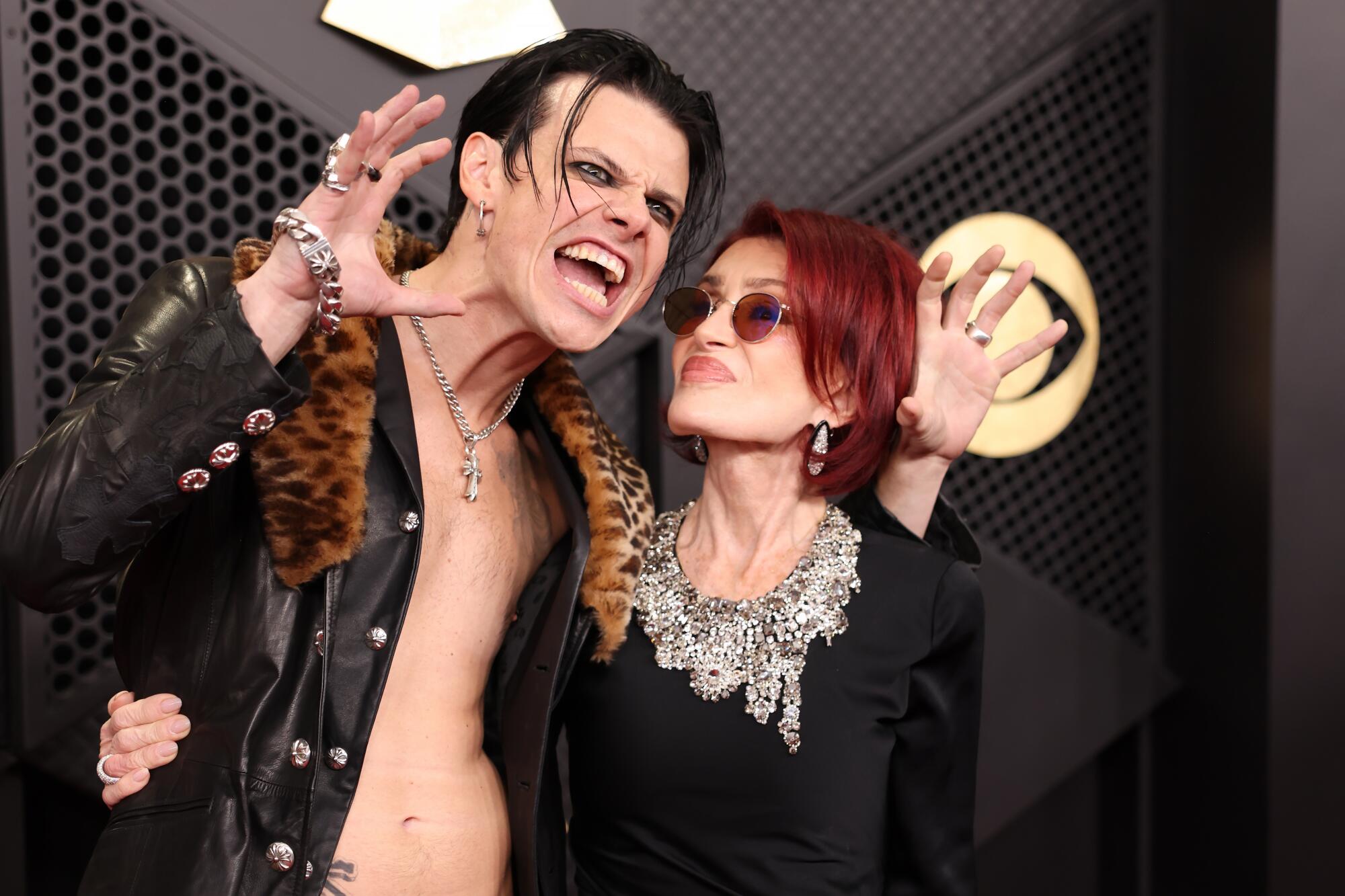 Yungblud and Sharon Osbourne pose on the red carpet.