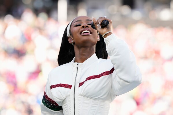 Coco Jones performs "Lift Every Voice and Sing" before the NFL Super Bowl 60 football game between the New England Patriots and the Seattle Seahawks, Sunday, Feb. 8, 2026, in Santa Clara, Calif. (AP Photo/Doug Benc)