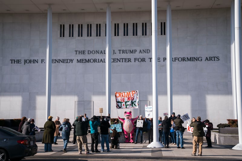 Protesters gather in front of the The John F. Kennedy Center for the Performing Arts after President Donald Trump's name was added to the facade on Dec.20, 2025 in Washington, DC.