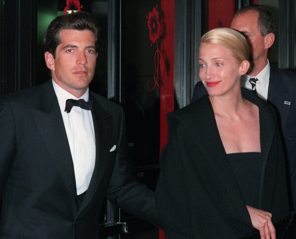 ** FILE ** In a file photo John F. Kennedy, Jr. and his wife, Carolyn Bessette Kennedy, arrive at the Minskoff Theatre Monday night, April 6, 1998.    Almost eight years after John F. Kennedy Jr. and Carolyn Bessette Kennedy , and Lauren Bessette died in a plane crash, federal officials on Tuesday, Feb. 6, 2007, released an audio clip of an airport intern and a Federal Aviation Administration dispatcher discussing the missing plane.  (AP Photo/Mitch Jacobson)