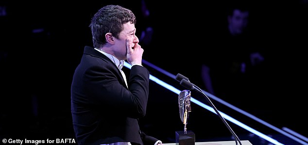 LONDON, ENGLAND - FEBRUARY 22: Robert Aramayo accepts the Leading Actor Award for 'I Swear' on stage during the EE BAFTA Film Awards 2026 at The Royal Festival Hall on February 22, 2026 in London, England. (Photo by Tristan Fewings/BAFTA/Getty Images for BAFTA)