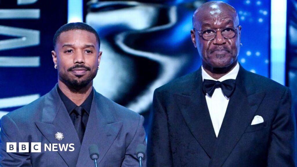 Michael B. Jordan and Delroy Lindo present the Special Visual Effects Award on stage during the EE BAFTA Film Awards 2026 at The Royal Festival Hall on February 22, 2026 in London, England.