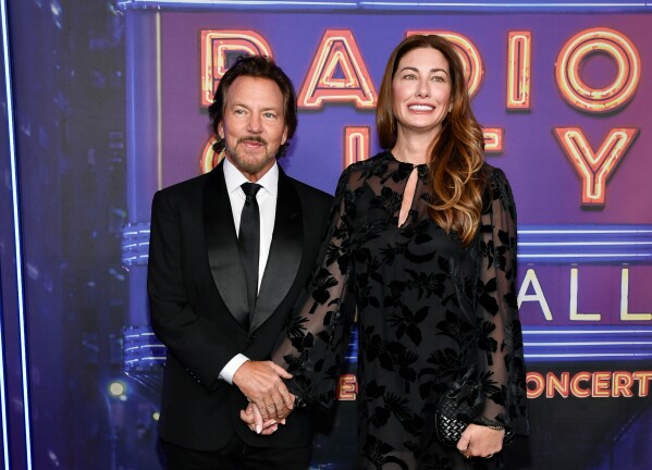 Eddie Vedder, left, and his wife Jill Vedder appear at the SNL50: The Homecoming Concert in New York on Feb. 14, 2025, (Photo by Evan Agostini/Invision/AP, File)
