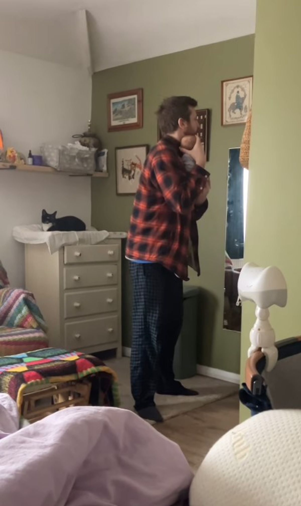 a man holding a baby